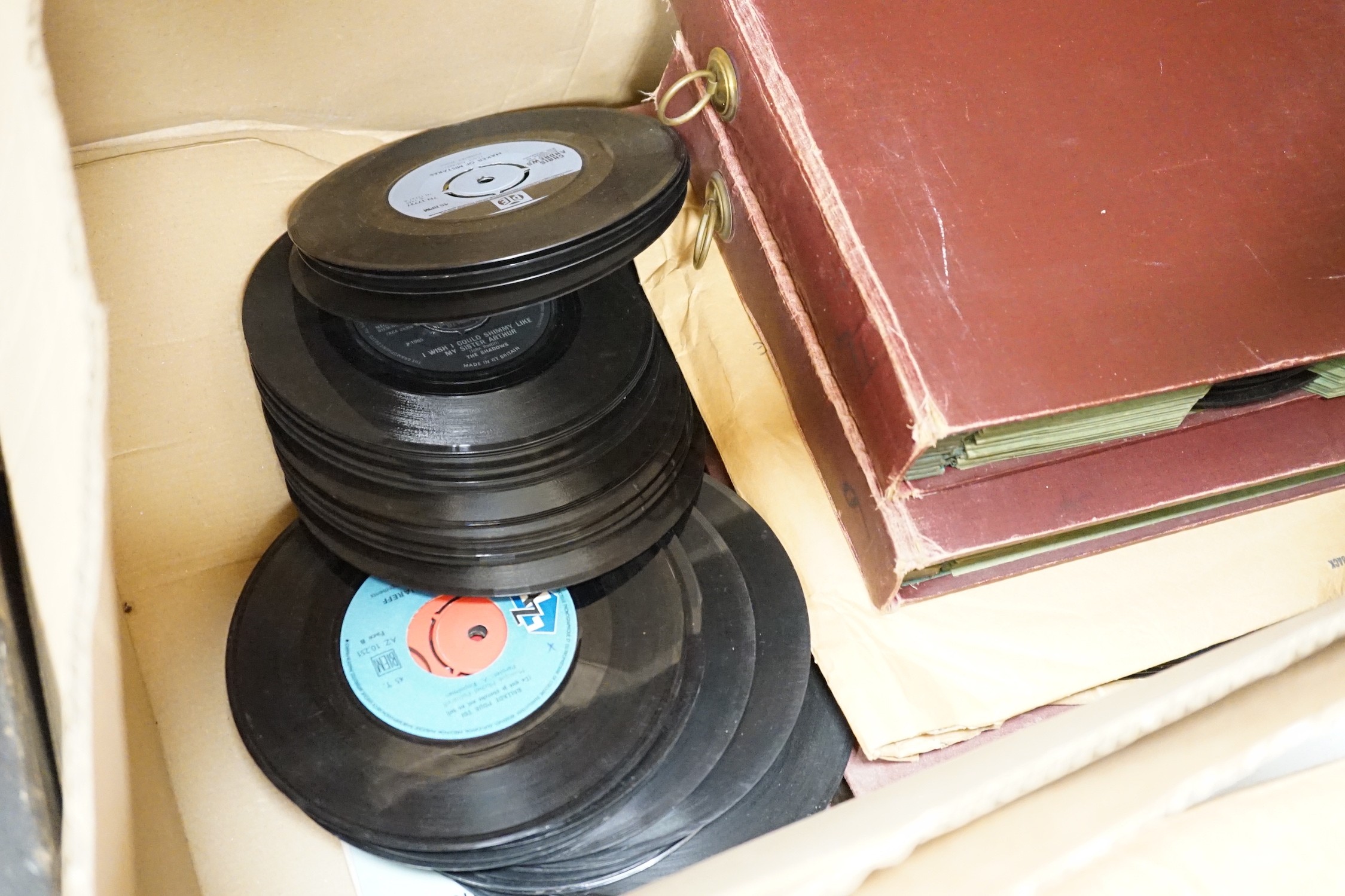 An HMV tabletop wind up gramaphone and records